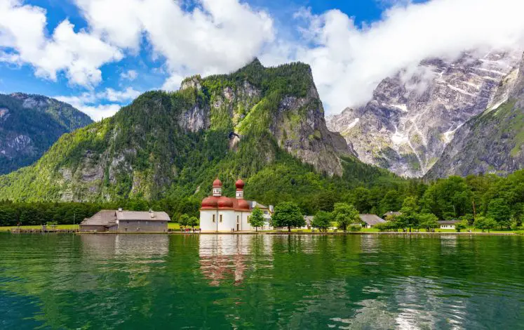 The pilgrimage church of St. Bartholomä is located on the western shore of Lake Königsee on the Hirschau peninsula