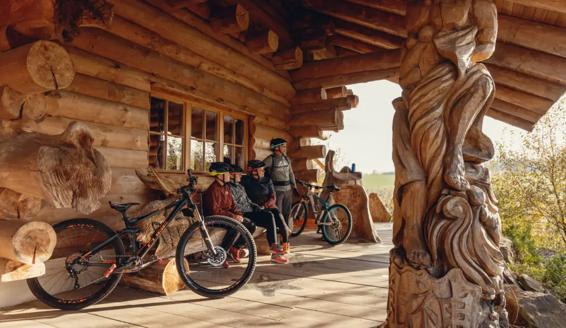 Cyclist under a wooden shelter