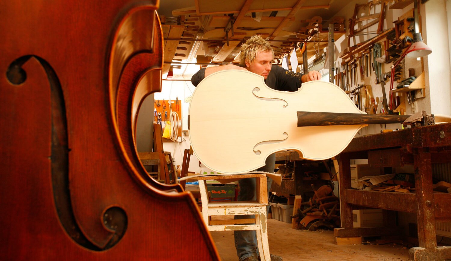 Also the big double basses are made here according to old handicraft tradition