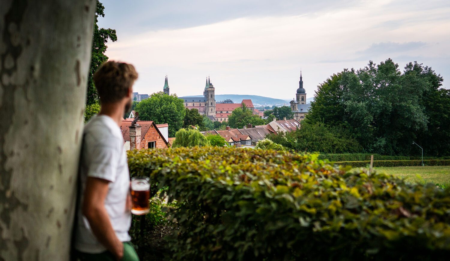Organic gardener Sebastian Niedermaier enjoys the view over the city of Bamberg